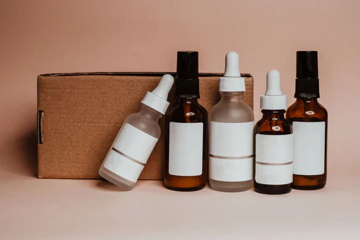 5 Boston round bottles with different closures