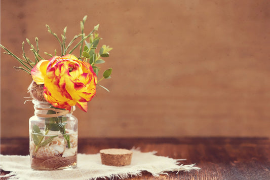 small glass jar used a flower vase