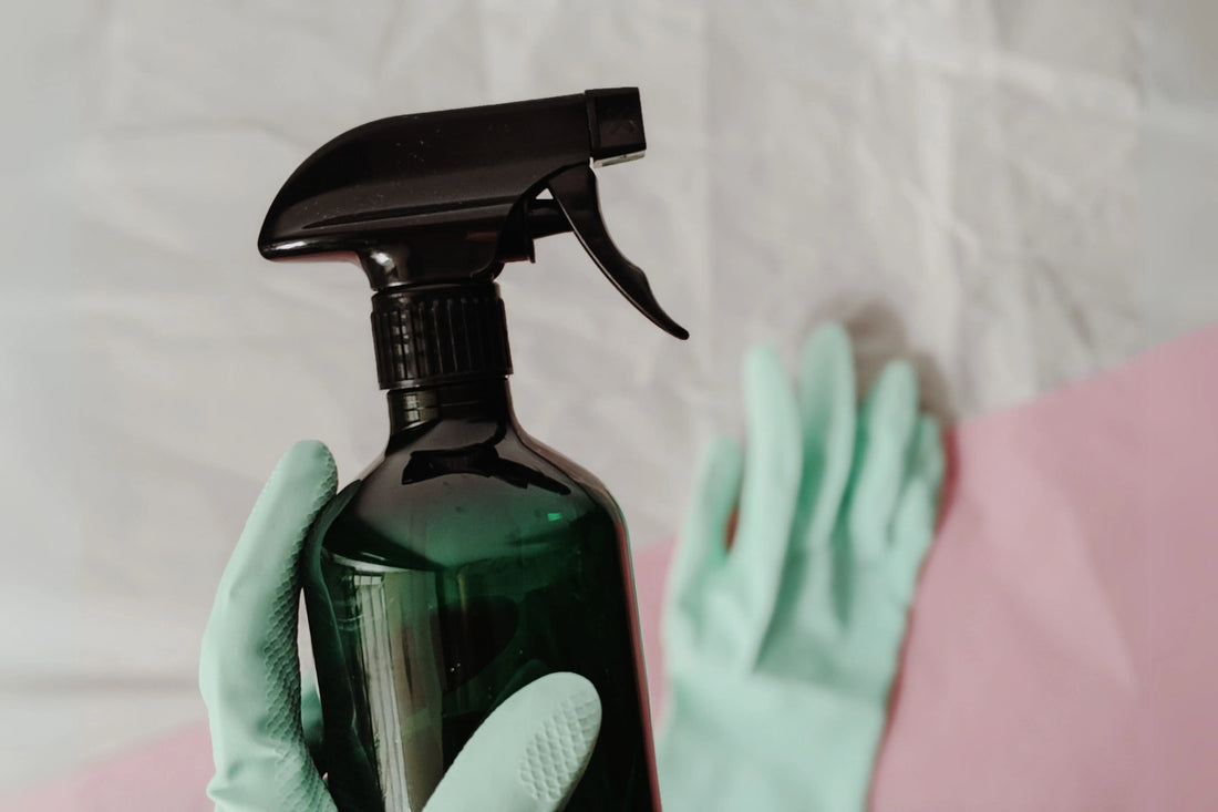 a trigger spray bottle being cleaned